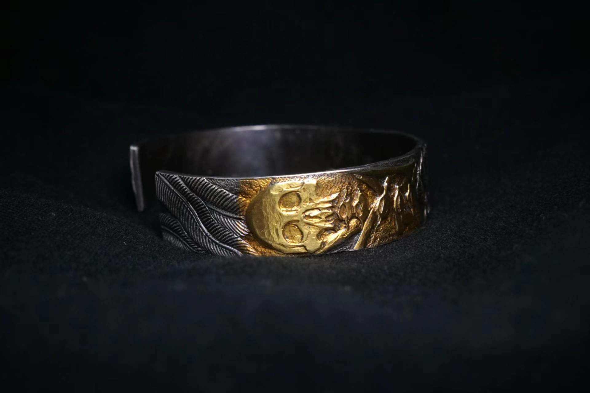 Finished black and gold engraved silver cuff